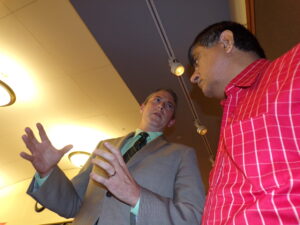 Moench, left, talks with Bridgewater voter Ketan Thakker at Monday night's Planning Board meeting. Both spoke in opposition to the scale of a project on Highway 206 that has galvanized NIMBY voters.