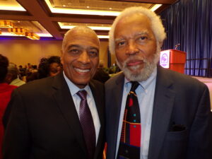 Activist Emeritus Larry Hamm, left, and Dr. Junius Williams, both spoke at the conference and were front and center to hear Baraka.